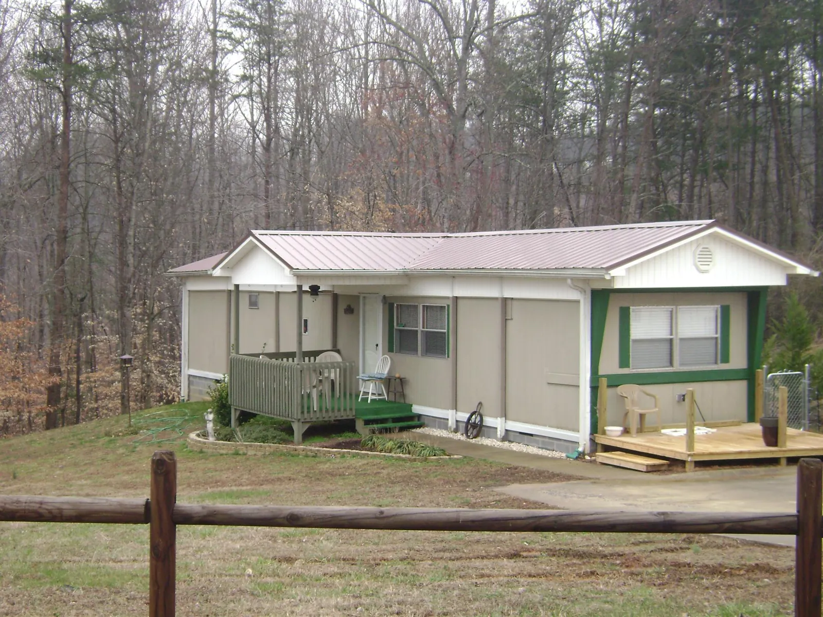 Mauve metal roof on a manufactured home with a new front deck in Parkers Prairie